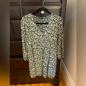 V-neck button-front mini dress in forest leaves